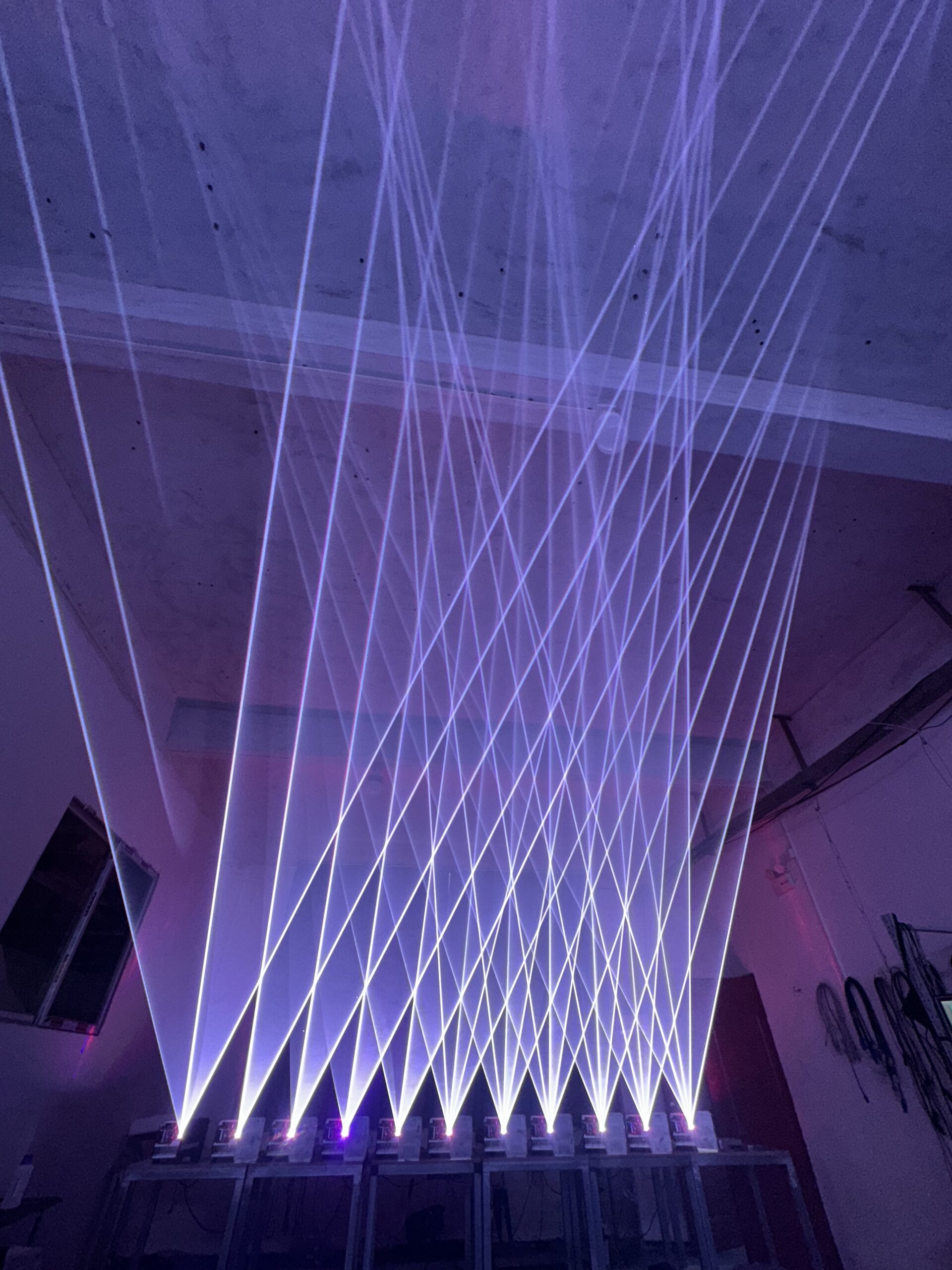 Safe Laser Show Effects A beautiful laser show in a concert with beams over the crowd's heads